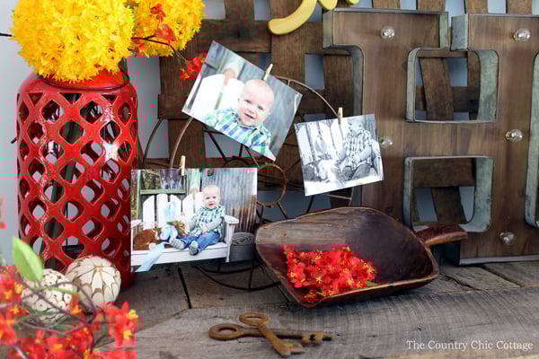 vintage wheel with photos on mantel