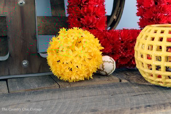 yellow flower ball on farmhouse mantel