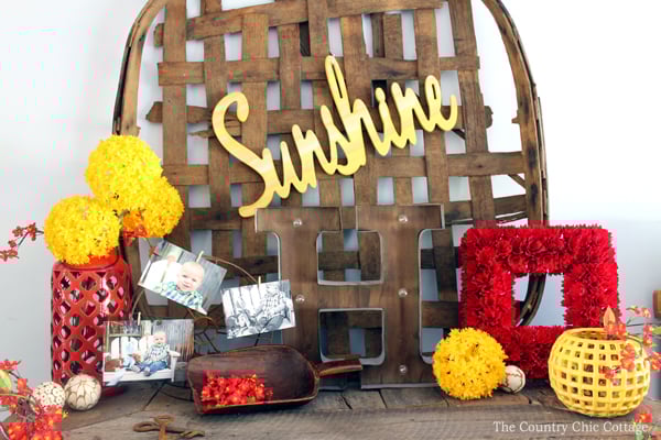 red, yellow, and wood farmhouse style mantel