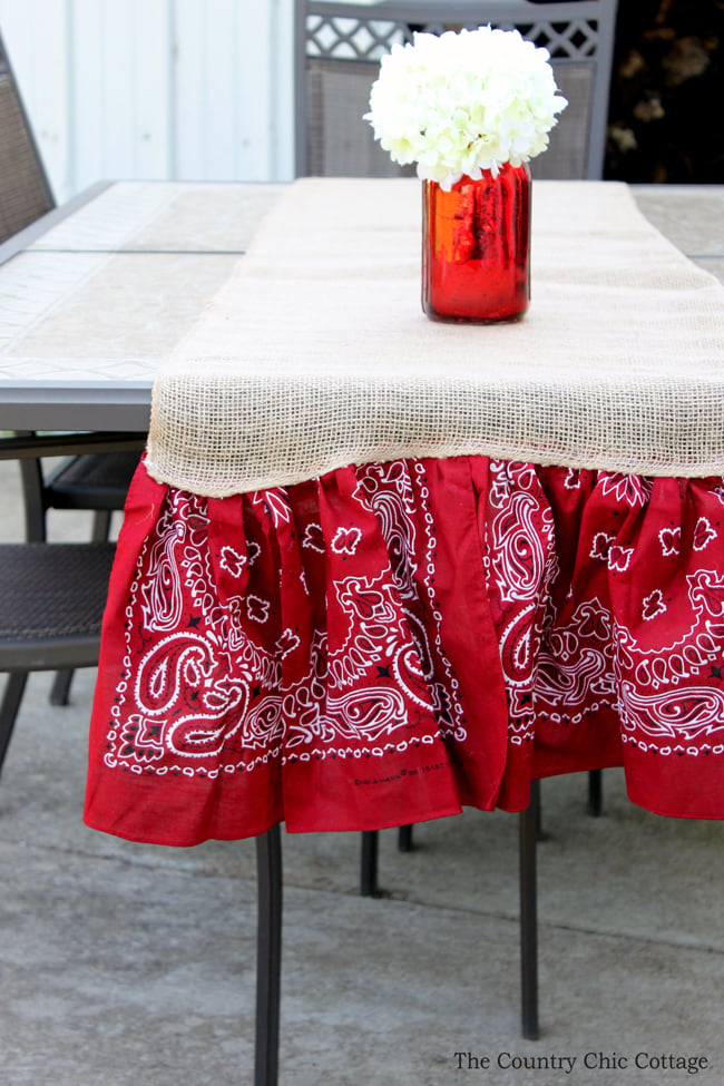 burlap table runner with red bandanna.