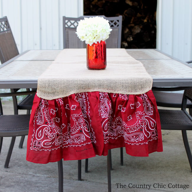 summer burlap table runner with red mason jar