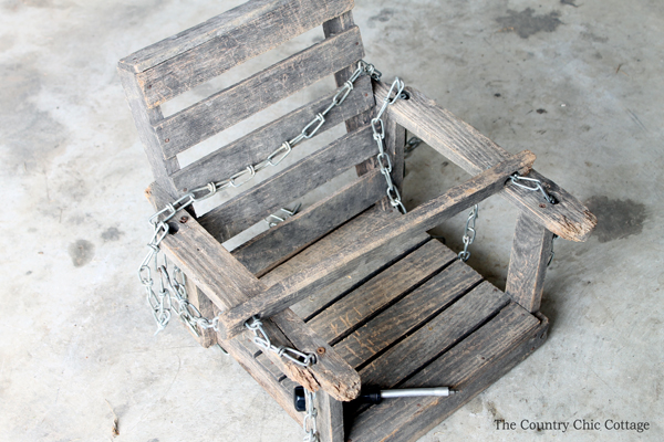 Details on this wood baby swing refinish! You can revitalize an old wooden swing like this as well!