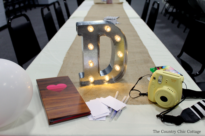 Create bridal shower memories using a FujiMax polaroid camera and loving messages from guests