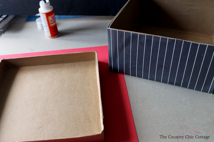 Cover a plain box in crafting paper to create a recipe card box