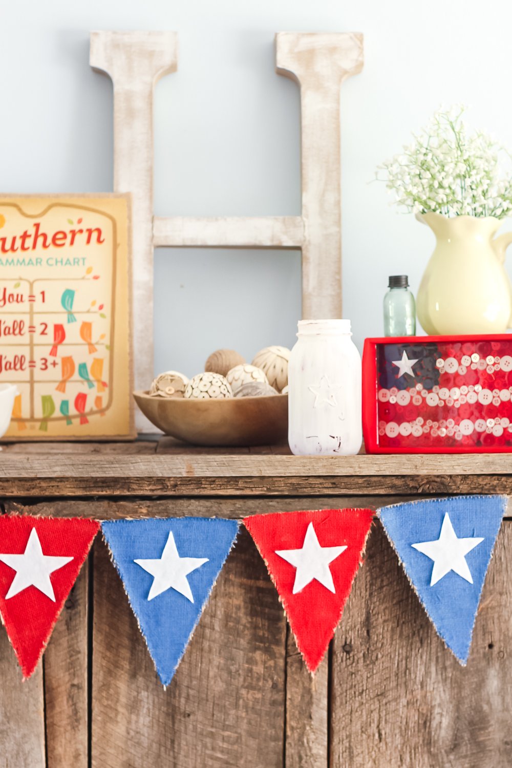 farmhouse style patriotic banner hanging up
