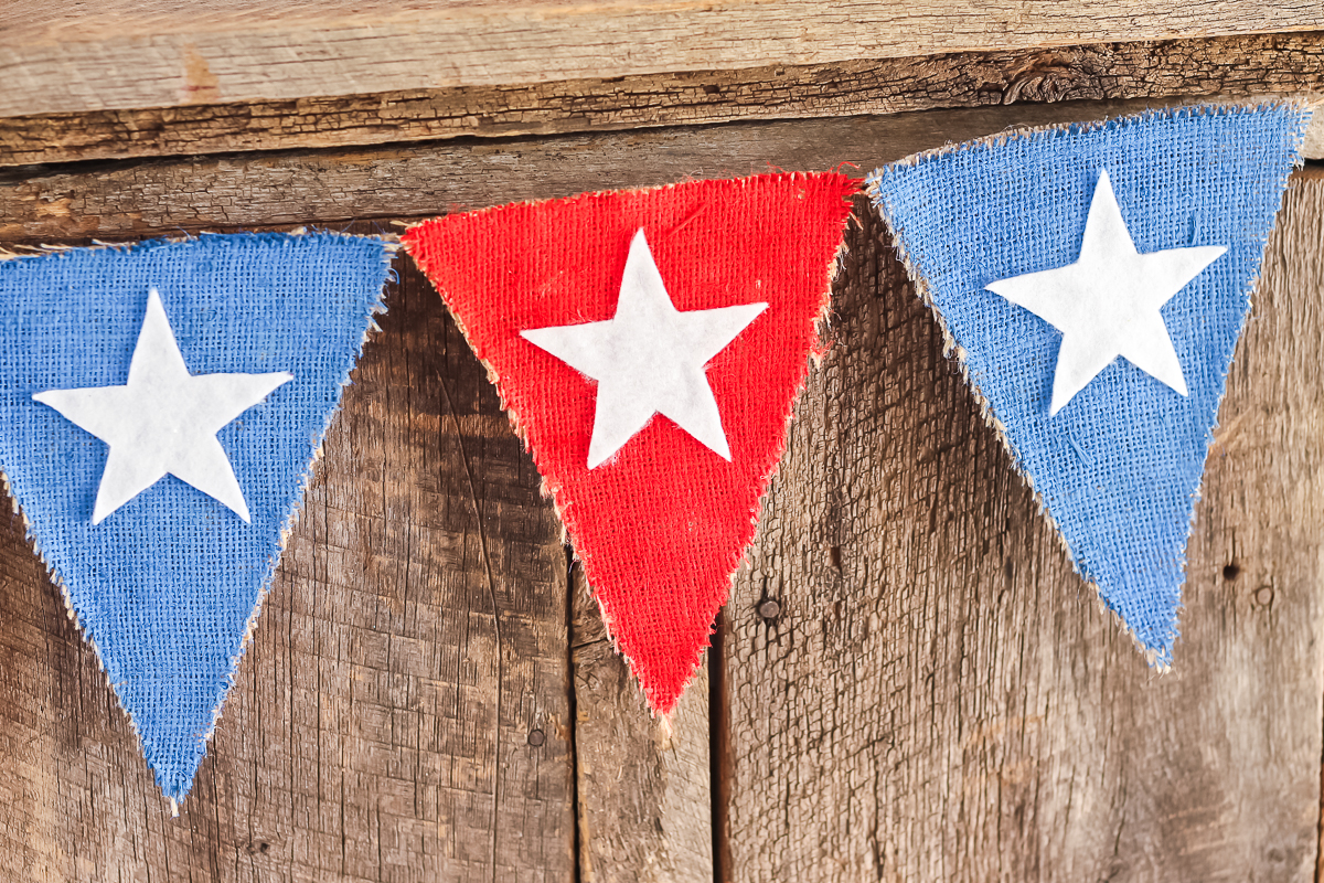 burlap banner painted red, white, and blue