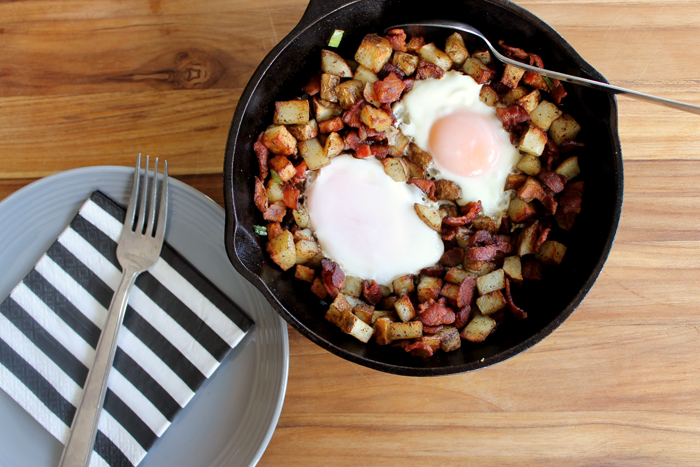 This breakfast skillet is made with fried eggs, potatoes, bacon, and delicious veggies