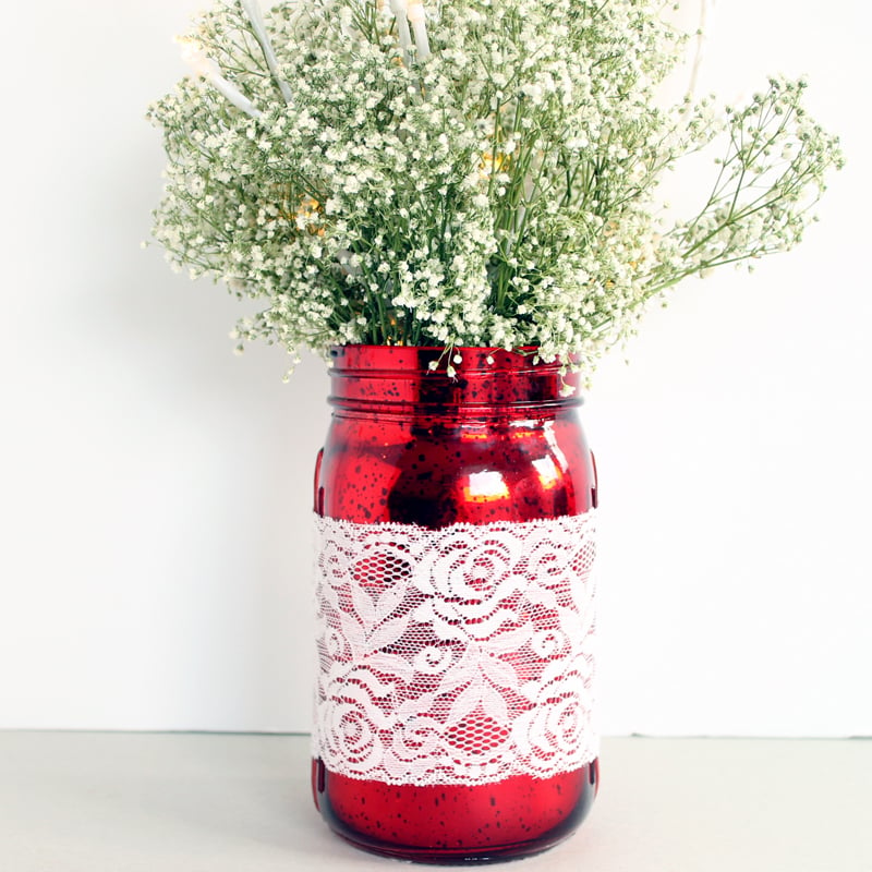 red mason jar wedding centerpiece with white lace 