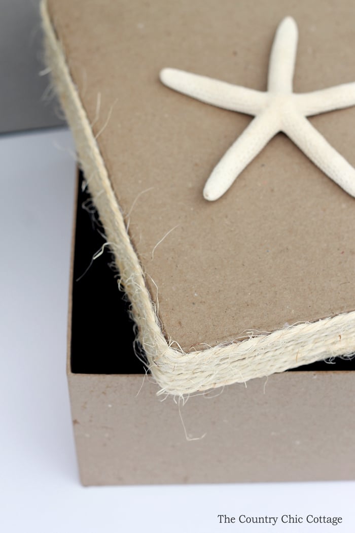 cardboard box with jute rope and a starfish