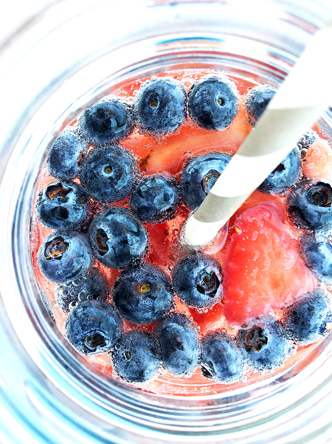 Yummy strawberries and blueberries in Sprite