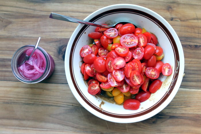 Make this tomato salad recipe with pickled red onions! A great summer salad that everyone will love!
