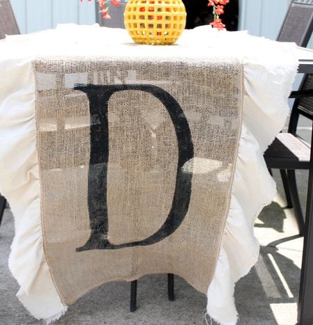 Make this DIY burlap table runner with monogram for your home! I love the simple ruffles on the side as well!
