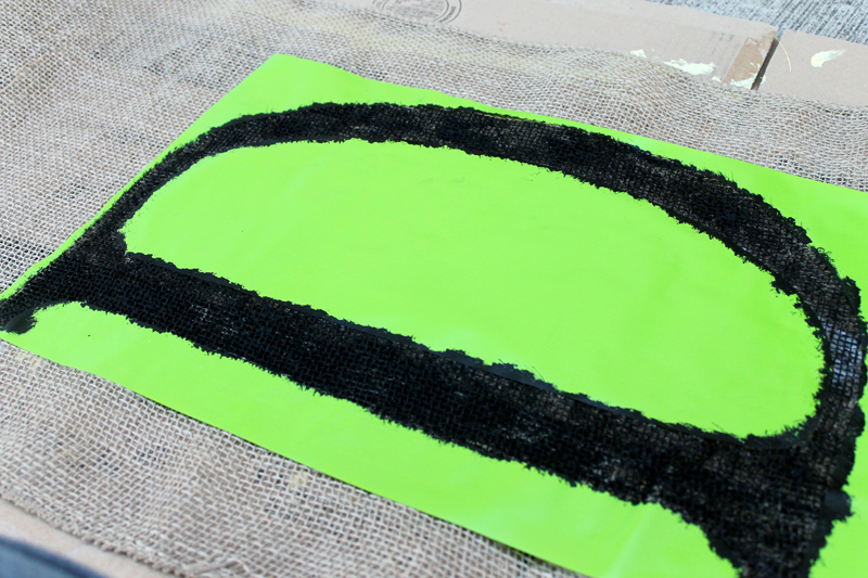painting the letter d on burlap in black