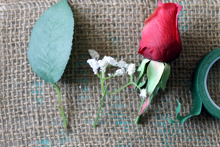 artificial rose with baby's breath and floral tape