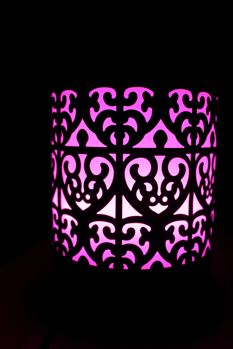 An essential oil diffuser lighting up in the dark 