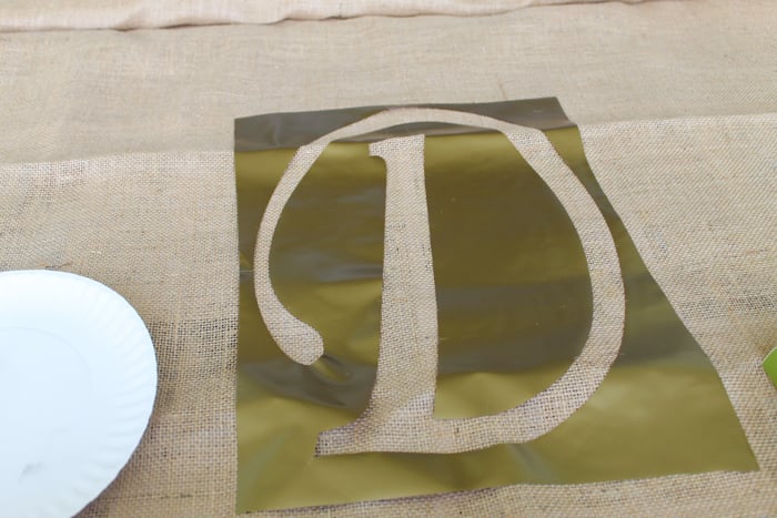 stenciling a monogram onto burlap