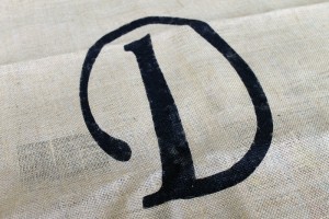 painted D on burlap