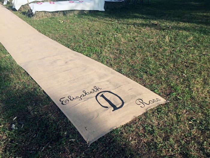 Make this DIY burlap aisle runner for your wedding! A gorgeous way to add a rustic touch to your barn wedding!