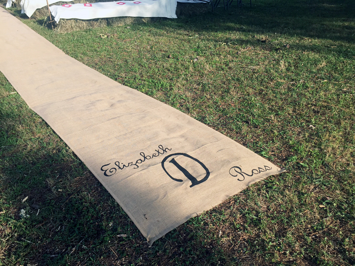 barn wedding with a burlap runner