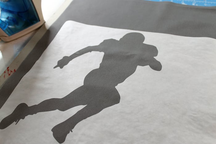 Make these DIY football silhouette pillows with a few simple supplies! A quick and easy project that is perfect for a boy's room!