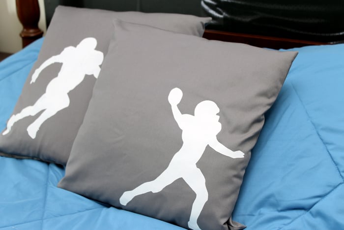 Make these DIY football silhouette pillows with a few simple supplies! A quick and easy project that is perfect for a boy's room!
