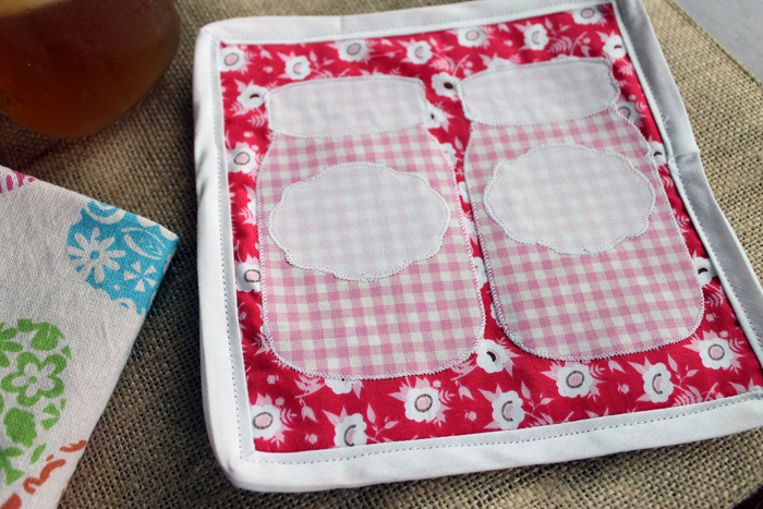 closeup of DIY potholder with mason jars on it