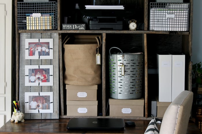 Make the most out of your desk storage hutch with eclectic baskets, picture frames, and boxes to help organize your work space