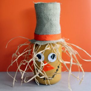 Make this scarecrow jar fall craft idea for your autumn home! A fun craft that the kids will love to help with!