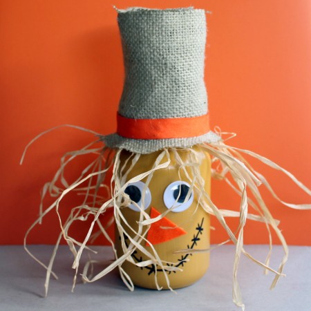 Make this scarecrow jar fall craft idea for your autumn home! A fun craft that the kids will love to help with!