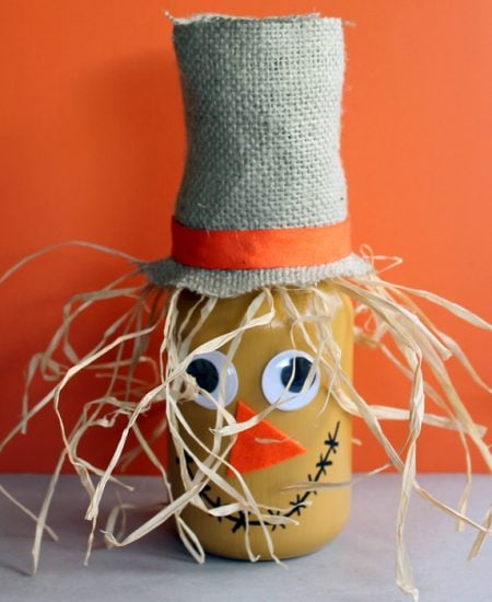 Make this scarecrow jar fall craft idea for your autumn home! A fun craft that the kids will love to help with!