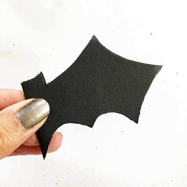 bat cutout folded in half to cut a symmetrical shape