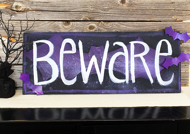 completed Halloween Beware sign with bat cutouts