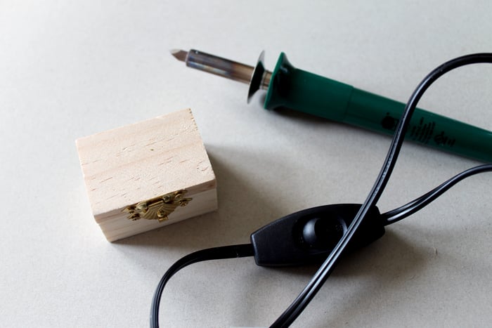 small wooden box with wood burning tool