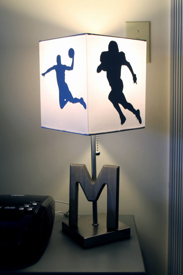 DIY sports lamp with the light on so the shapes shine through