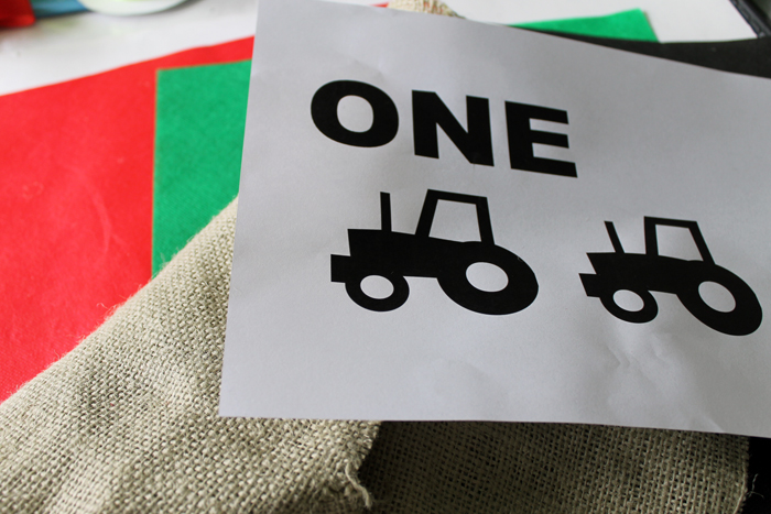 Print out the ONE and tractor graphics for the highchair birthday banner