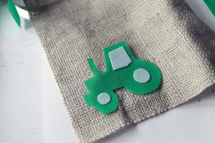 making the tractor themed highchair birthday banner