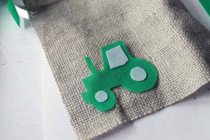 Making the tractor themed highchair birthday banner