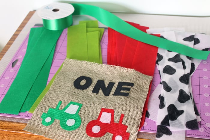 We're making a first birthday highchair banner using ribbon and burlap!