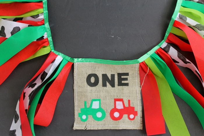 This farm themed first birthday banner is ready for the birthday baby's highchair!