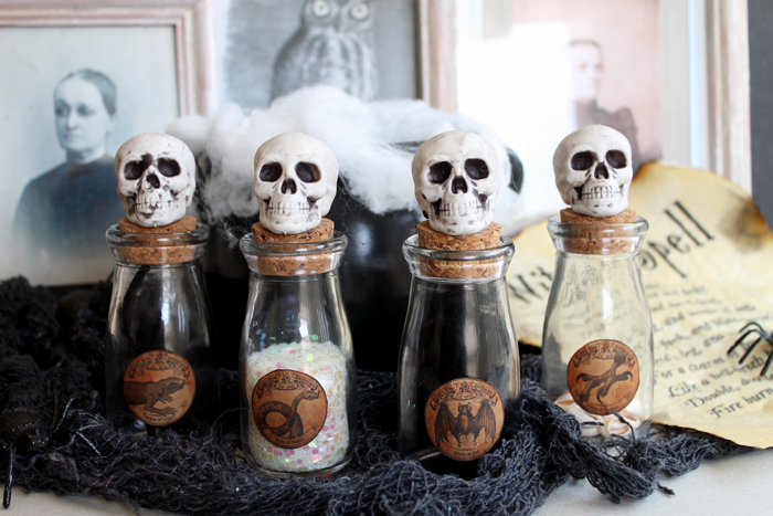 Potions bottle with spell sheets and spooky decorations