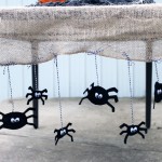 I am in love with this Halloween table runner! Great idea with the burlap and spiders!