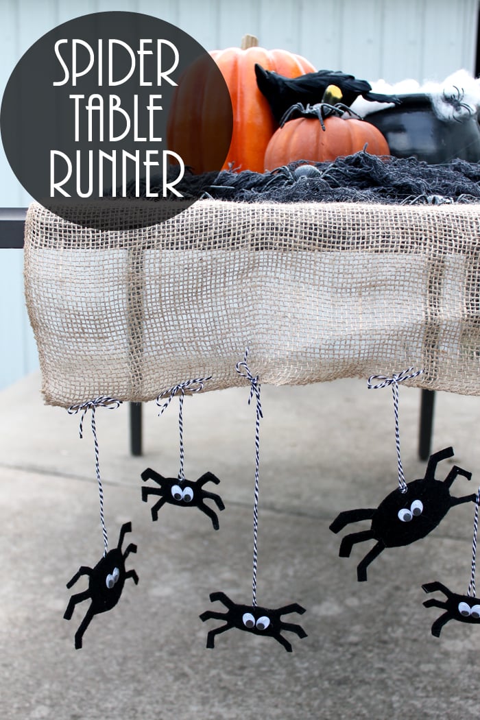 I am in love with this Halloween table runner! Great idea with the burlap and spiders!