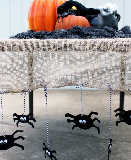 I am in love with this Halloween table runner! Great idea with the burlap and spiders!