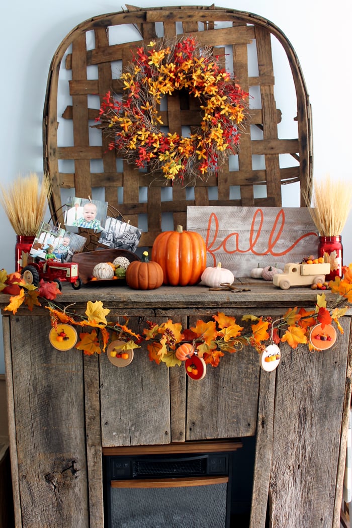 Mantle decorated for fall which includes this DIY autumn banner