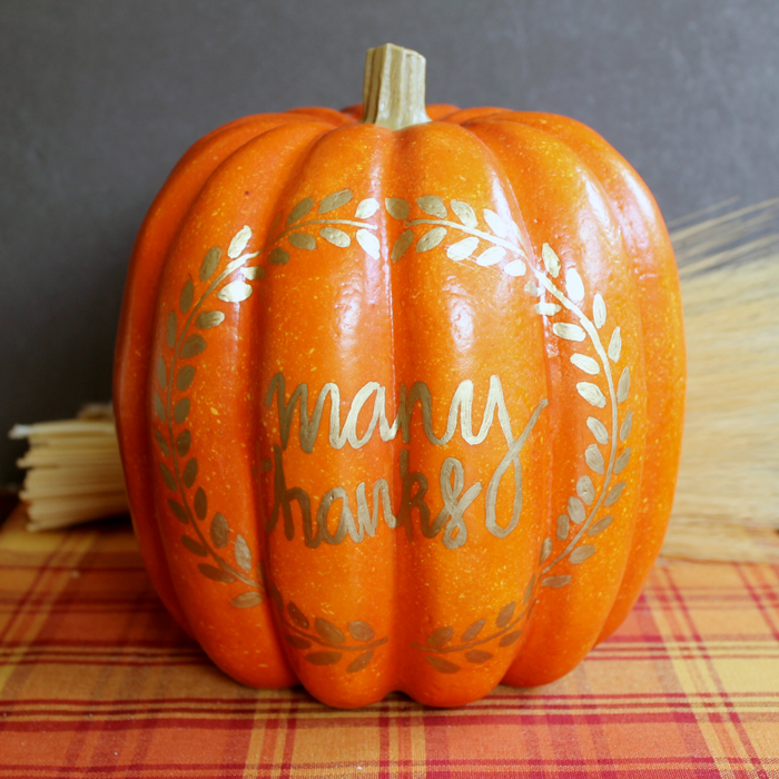 front view of pumpkin with gold drawing