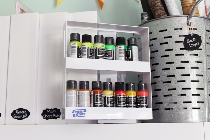 craft paint organized in a swivel spice rack