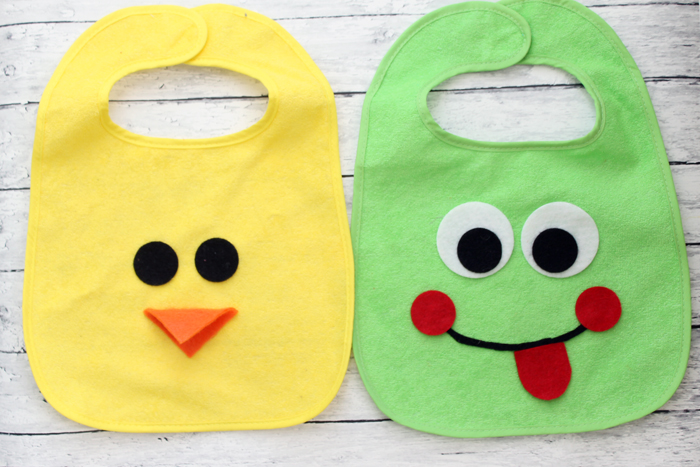 a handmade duck and frog bibs for babies