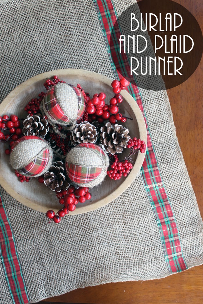 burlap runner with wooden bowl on top filled with decorations