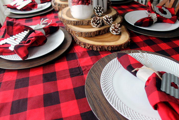 faux wooden chargers underneath white plates 