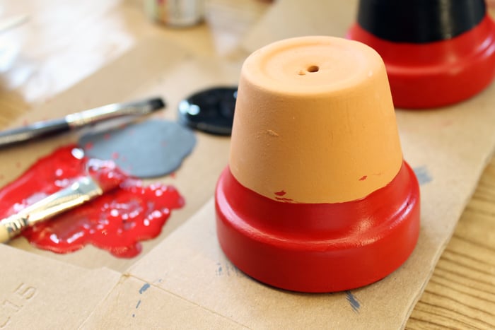 terra cotta pot partially painted red